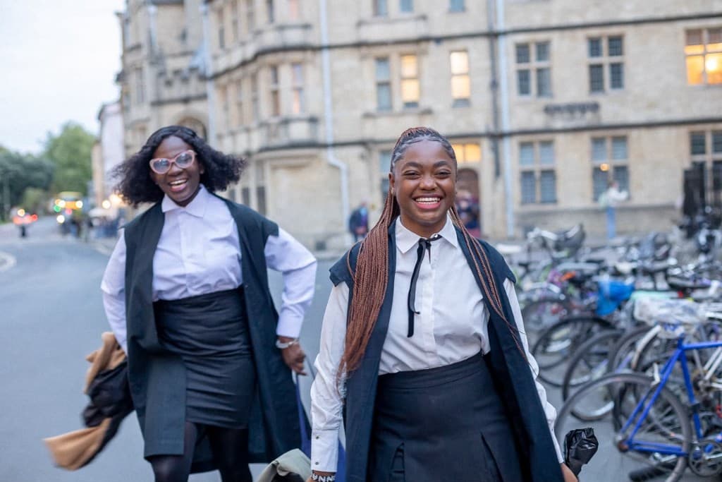 Young graduates walking together
